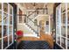 Grand foyer with hardwood floors, staircase, and detailed trim work at 454 Langley Oaks Dr, Marietta, GA 30067