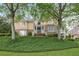 Charming stone and stucco home with mature trees and lush landscaping at 454 Langley Oaks Dr, Marietta, GA 30067