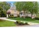 Inviting home with a circular driveway, mature trees, and well-maintained lawn at 454 Langley Oaks Dr, Marietta, GA 30067