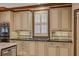 Close up of kitchen cabinets with stainless oven, cooktop, and neutral backsplash at 454 Langley Oaks Dr, Marietta, GA 30067