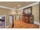 Upstairs landing featuring hardwood floors, decorative trim, and a charming furniture piece at 454 Langley Oaks Dr, Marietta, GA 30067