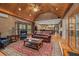 Spacious living room with hardwood floors, ceiling fan, and a view into the kitchen area at 454 Langley Oaks Dr, Marietta, GA 30067