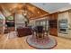 Vaulted living area with stone fireplace, hardwood floors, and bar-height seating at 454 Langley Oaks Dr, Marietta, GA 30067