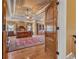 Luxurious main bedroom with hardwood floors, tray ceiling, and elegant furnishings at 454 Langley Oaks Dr, Marietta, GA 30067