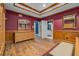 Spacious main bedroom featuring hardwood floors, tray ceiling, and en suite bathroom at 454 Langley Oaks Dr, Marietta, GA 30067
