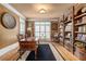 Office with hardwood floors, custom built-in shelves, and natural light at 454 Langley Oaks Dr, Marietta, GA 30067