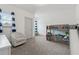 Bright bedroom with bunk bed and chair, perfect for relaxation or play at 4702 Jellico Dr, Powder Springs, GA 30127