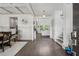 Elegant entryway showcasing hardwood floors, coffered ceilings, and views into the dining and living areas at 4702 Jellico Dr, Powder Springs, GA 30127