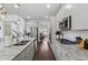 Modern kitchen features stainless appliances, granite countertops, and ample cabinet space at 4702 Jellico Dr, Powder Springs, GA 30127