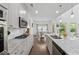 Modern kitchen features stainless appliances, granite countertops, and ample cabinet space at 4702 Jellico Dr, Powder Springs, GA 30127