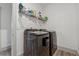 Laundry room with modern washer and dryer, wire shelf and white walls at 4702 Jellico Dr, Powder Springs, GA 30127