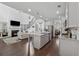 Open-concept living room and kitchen with hardwood floors, granite counters, and a cozy fireplace at 4702 Jellico Dr, Powder Springs, GA 30127