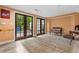 Finished basement featuring travertine flooring, french doors, and built in shelving at 557 E Wesley Ne Rd, Atlanta, GA 30305