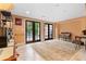 Finished basement featuring travertine flooring, french doors, and built in shelving at 557 E Wesley Ne Rd, Atlanta, GA 30305