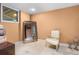 Finished basement space featuring tile flooring, a mirror, and classic chair at 557 E Wesley Ne Rd, Atlanta, GA 30305