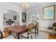 Open dining area with archway to living room and kitchen views at 557 E Wesley Ne Rd, Atlanta, GA 30305