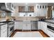 Bright kitchen featuring stainless steel appliances, Wolf range and granite counters at 557 E Wesley Ne Rd, Atlanta, GA 30305