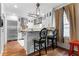 Kitchen with stainless steel appliances, hardwood floors, and a breakfast bar with barstool seating at 557 E Wesley Ne Rd, Atlanta, GA 30305