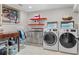 Functional laundry area featuring modern appliances and efficient storage solutions for organization at 557 E Wesley Ne Rd, Atlanta, GA 30305