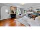 Living room featuring hardwood floors, fireplace, many windows, and an arched white front door at 557 E Wesley Ne Rd, Atlanta, GA 30305