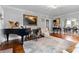 Spacious living room boasts hardwood floors, fireplace, and decorative furnishings at 557 E Wesley Ne Rd, Atlanta, GA 30305
