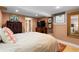 Spacious bedroom with neutral decor, which includes a bathroom with a shower visible in the background at 557 E Wesley Ne Rd, Atlanta, GA 30305