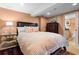 Comfortable bedroom with neutral tones, with an ensuite bathroom for added privacy at 557 E Wesley Ne Rd, Atlanta, GA 30305