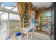 Sunroom with brick accent wall, red brick floors, and an abundance of natural light at 557 E Wesley Ne Rd, Atlanta, GA 30305