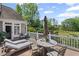 Inviting back deck featuring outdoor seating, lounge chairs, and scenic views of the lush green golf course at 6725 Polo Dr, Cumming, GA 30040