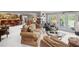 Spacious finished basement with a fireplace, seating area, and French doors to the exterior at 6725 Polo Dr, Cumming, GA 30040
