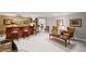 Spacious basement with a wet bar, artwork, wood furniture, and cozy seating areas at 6725 Polo Dr, Cumming, GA 30040