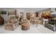 Basement including a seating area with plush chairs, a fireplace, and a bar area at 6725 Polo Dr, Cumming, GA 30040