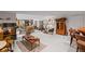 Large basement area featuring a fireplace, a bar, wood furniture, and ample seating at 6725 Polo Dr, Cumming, GA 30040
