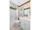 Well-maintained bathroom with a shower-tub combo, double vanity, and floral valance at 6725 Polo Dr, Cumming, GA 30040