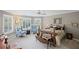 Inviting bedroom with natural light, a four-poster bed, shuttered windows, and cozy seating at 6725 Polo Dr, Cumming, GA 30040