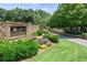 Community entrance with stone and beautiful landscaping at 6725 Polo Dr, Cumming, GA 30040