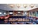 Upscale dining room featuring a full bar, multiple TVs, and comfortable seating for a premium experience at 6725 Polo Dr, Cumming, GA 30040