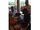 Chef with fresh ingredients on display, offering a culinary experience for residents and guests at 6725 Polo Dr, Cumming, GA 30040