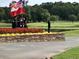 Golf course memorial with honor guard and flowers, set against a backdrop of rolling green hills at 6725 Polo Dr, Cumming, GA 30040
