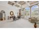 Bright living room offering coffered ceilings, fireplace, natural light, and comfortable seating at 6725 Polo Dr, Cumming, GA 30040