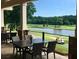 Relaxing outdoor patio overlooking the lush golf course and pond, perfect for dining at 6725 Polo Dr, Cumming, GA 30040