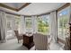Cozy sitting area with bright windows, plantation shutters, and elegant curtains at 6725 Polo Dr, Cumming, GA 30040