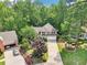 Aerial view of a house with mature landscaping at 989 Pinfeather Ct, Lawrenceville, GA 30043