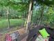 Inviting backyard deck with green pillow and tree-filled background at 989 Pinfeather Ct, Lawrenceville, GA 30043