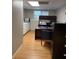 Basement office space featuring a desk with drawers and a spacious countertop with cabinets for ample storage at 989 Pinfeather Ct, Lawrenceville, GA 30043