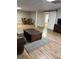 Finished basement featuring wood flooring, a sliding barn door, a coffered ceiling, and an open layout at 989 Pinfeather Ct, Lawrenceville, GA 30043
