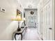 Inviting foyer with hardwood floors, elegant lighting, and a view of the front door at 989 Pinfeather Ct, Lawrenceville, GA 30043
