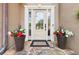 Welcoming front entrance with decorative planters and a stylish front door at 989 Pinfeather Ct, Lawrenceville, GA 30043