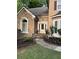 Beautiful stone and siding home with manicured landscaping and front door at 989 Pinfeather Ct, Lawrenceville, GA 30043