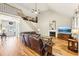 Spacious living room featuring a fireplace, hardwood floors, and high ceilings at 989 Pinfeather Ct, Lawrenceville, GA 30043